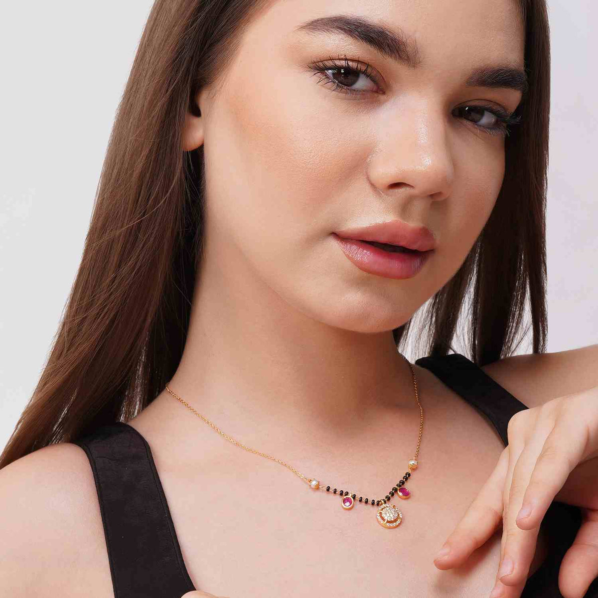 Asma gold plated mangalsutra with traditional black beads