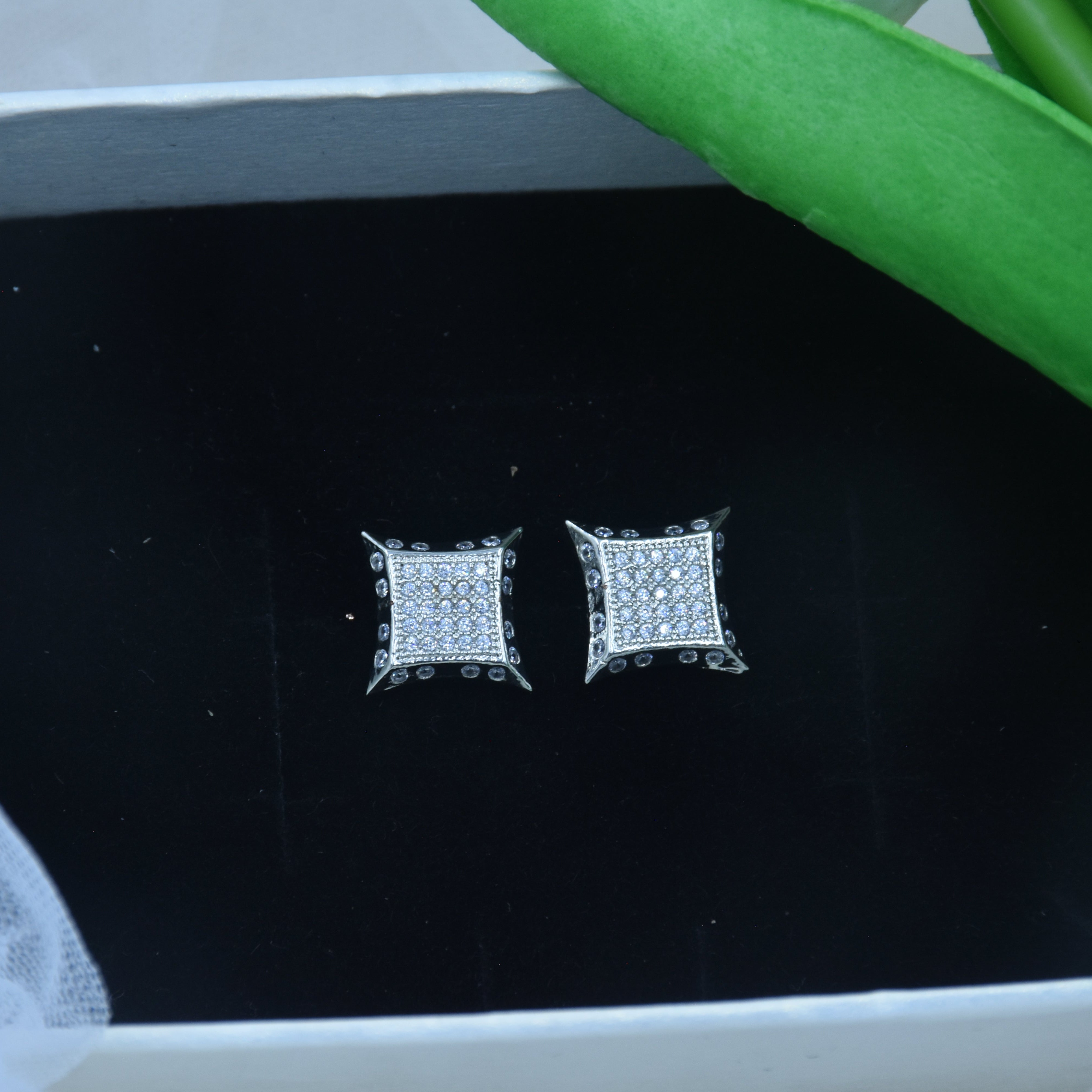 Silver finish CZ stud earrings with diamond cut shine